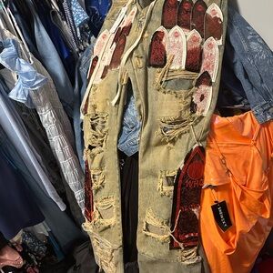 Edgy Distressed Jeans with Red and Tan Accents